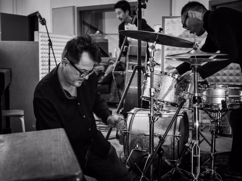 Rob setting up microphones on the drum kit at Hot Milk Studio
